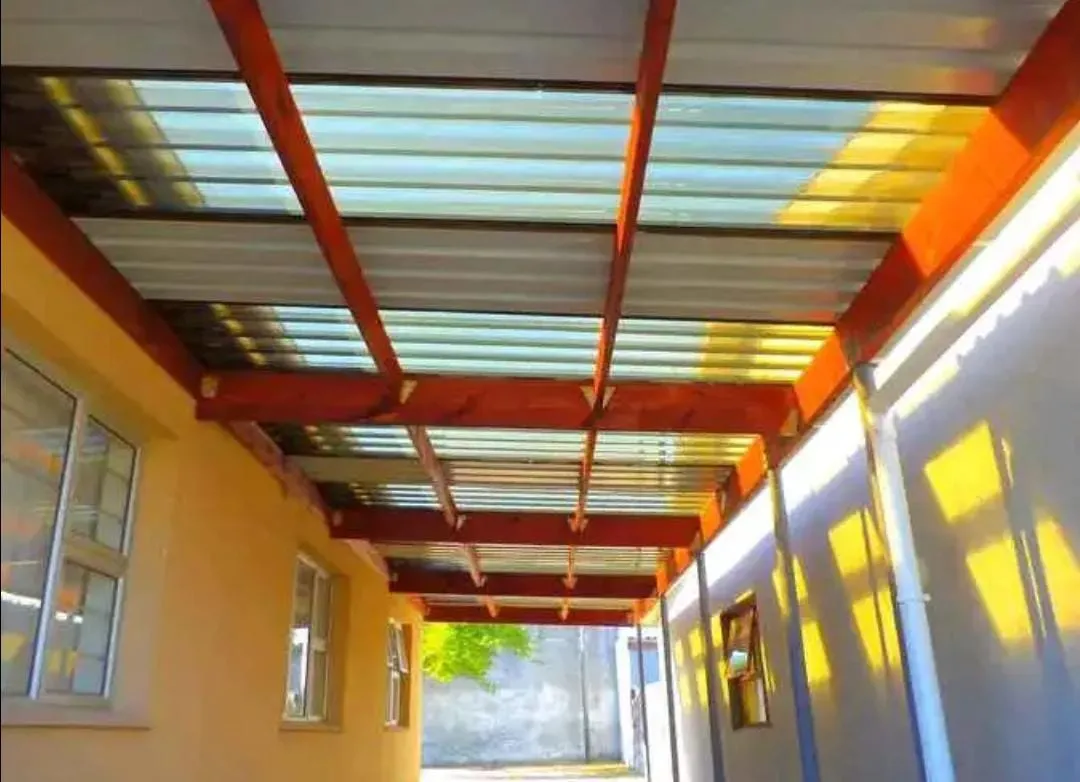 Covered walkway with timber beams and clear roof sheeting