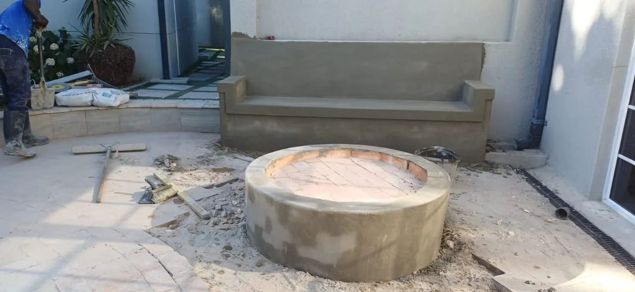 Built-in bench with circular fire pit