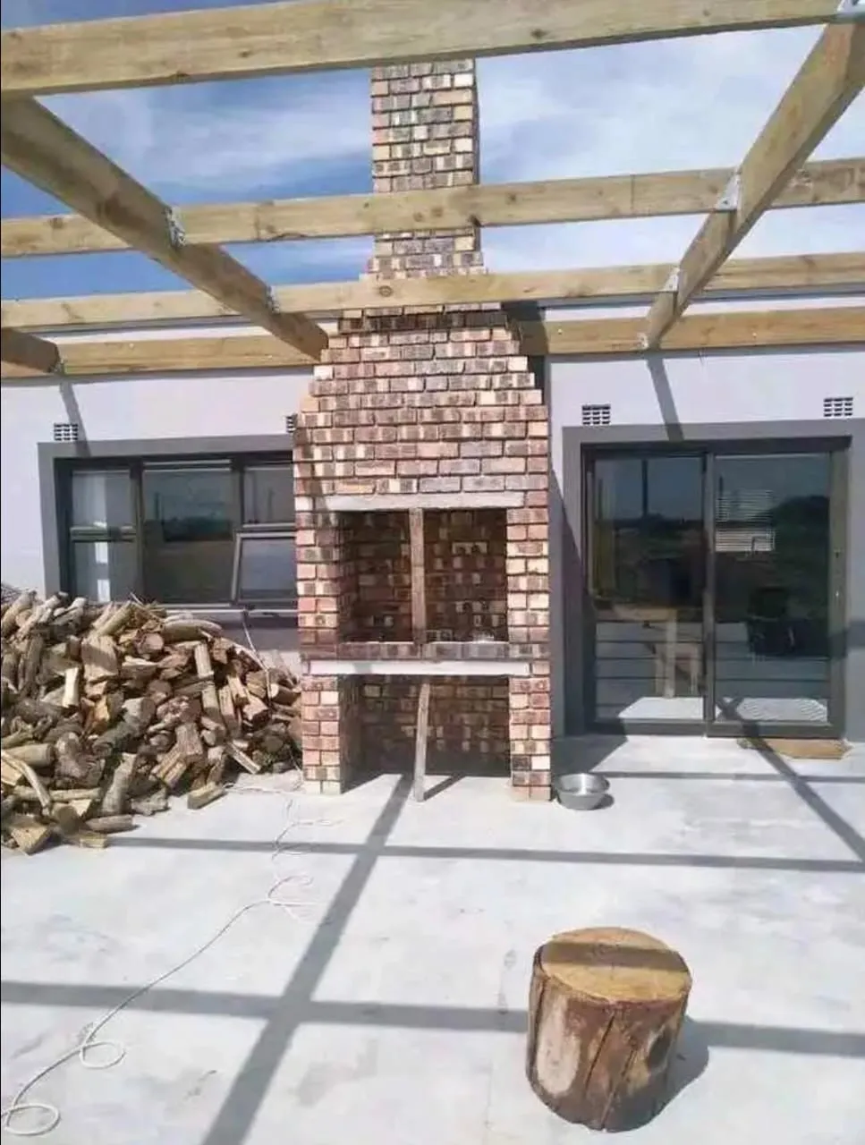Face-brick braai with chimney on a patio