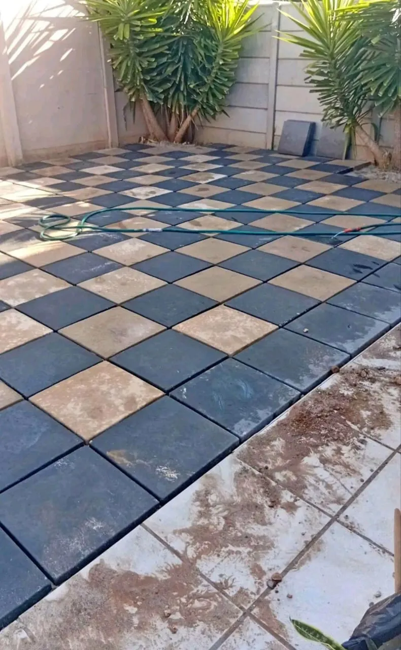 Diagonal checkerboard paving in charcoal and sandstone