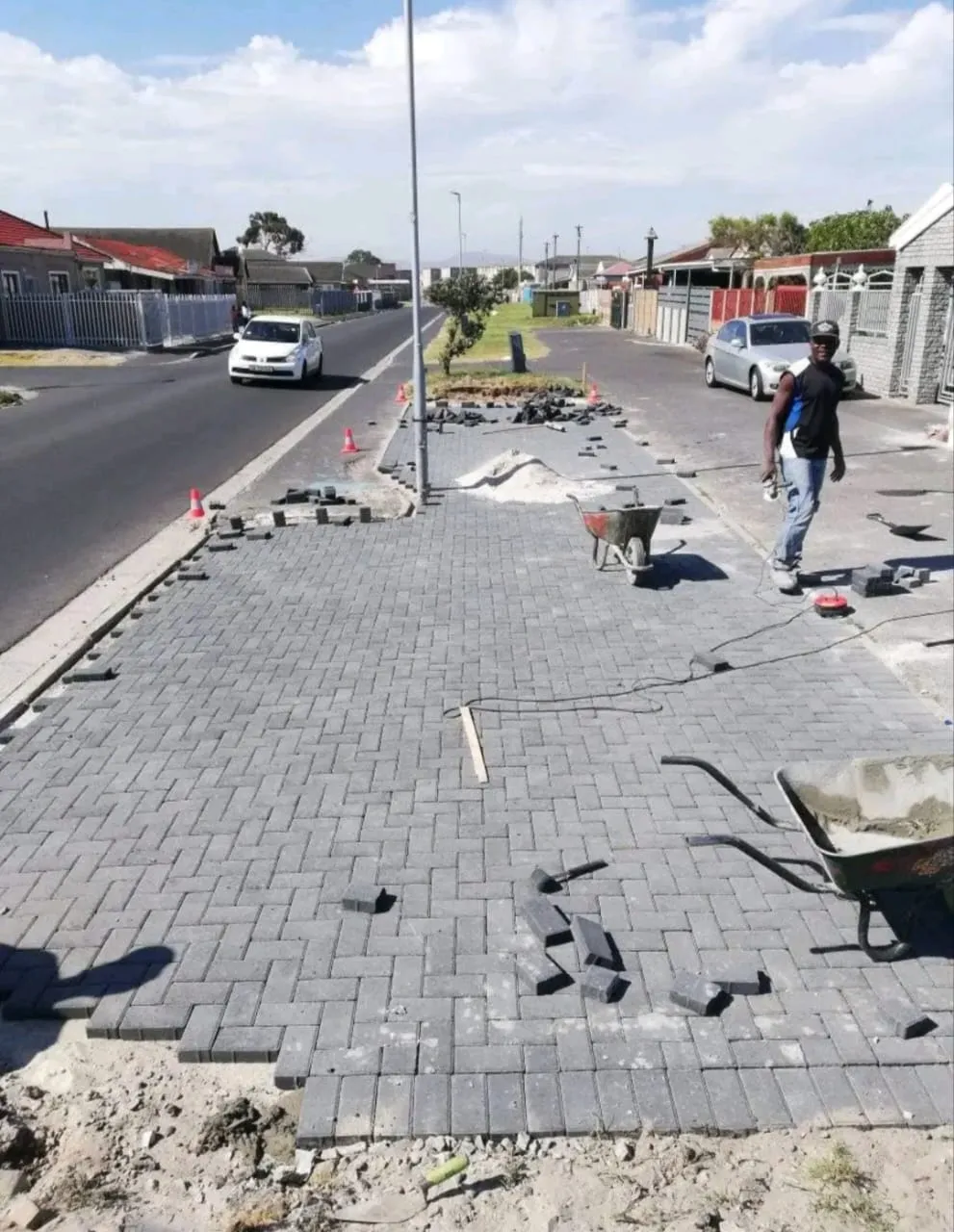 Pavement paving works in progress along a street